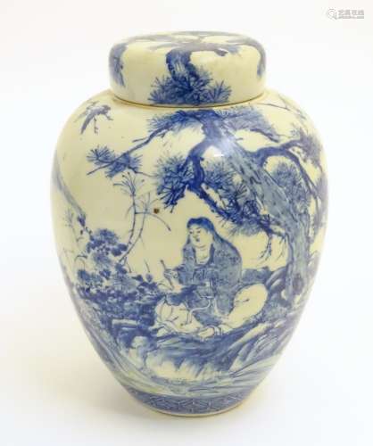 A large blue and white Japanese lidded ginger jar decorated with a sage sat by a tree in a