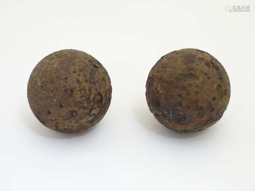 Militaria: a pair of 17thC English Civil War period iron cannonballs,