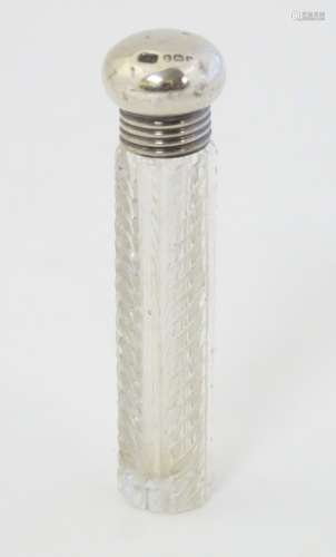A cut glass scent bottle with silver top hallmarked Birmingham 1909 maker Samuel M Levi 3 1/4