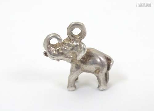 A novelty white metal pendant charm formed as an elephant.