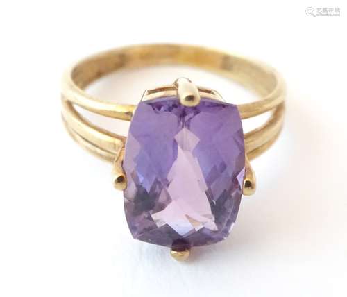 A 9ct gold ring set with facet cut amethyst. Ring size approx.