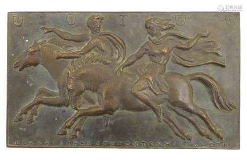 A bronze relief plaque depicting two figures riding galloping horses,