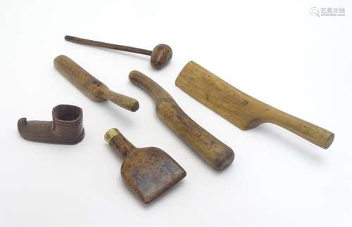 An assortment of antique roofing tools, together with a carved model of an Inuit mukluk boot.