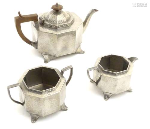 Decorative Metalware: Three items of Arts & Crafts style Sheffield pewter with hammered decoration