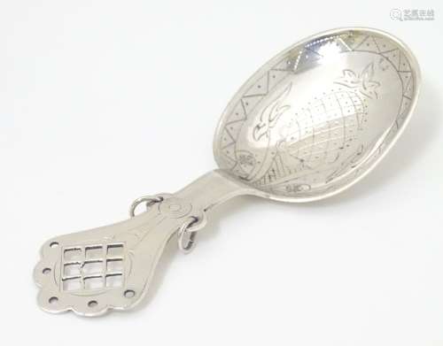 A Scandinavian silver caddy spoon with engraved decoration marked 830.S .
