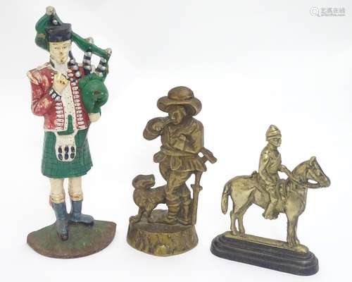 Three assorted door stoppers, formed as a man on horseback,