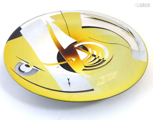 A large contemporary studio charger with overlay decoration cut back to reveal design of yellow,