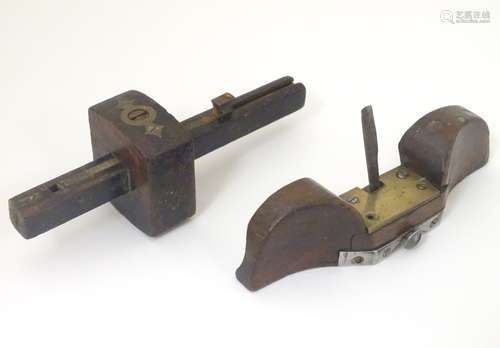 Two early 20thC carpentry tools, a marker gauge and spoke shave,