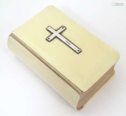 A small ivory bound book of common prayer with gilt page edges,