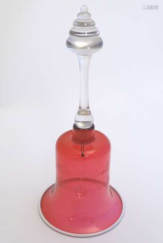 A Victorian cranberry glass bell engraved ' Mr & Mrs Ansell,