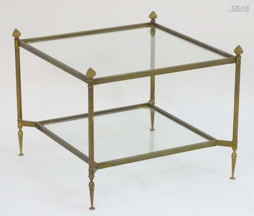 A 20thC two tier gilt and brass coffee table.