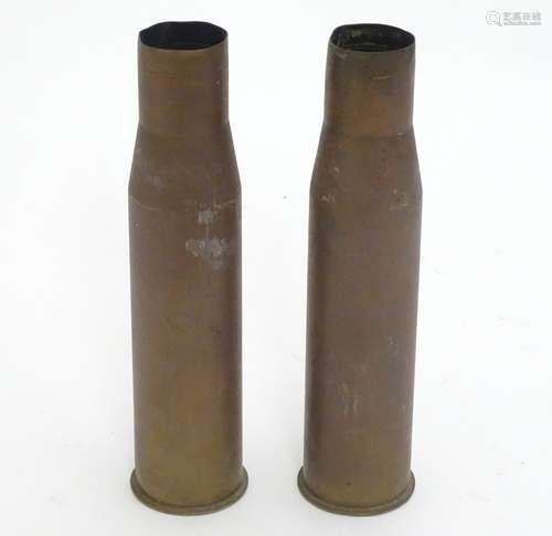 Militaria: a pair of 20thC 40mm Bofors cannon shell cases, headstamped 'M23 A2.