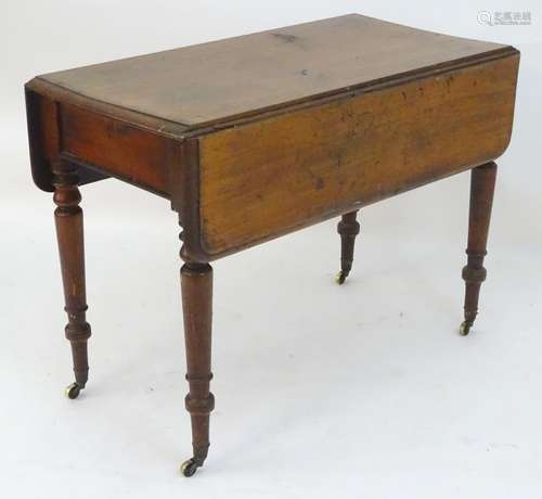 A late 19thC mahogany Pembroke table with a single end drawer and raised on turned tapering legs