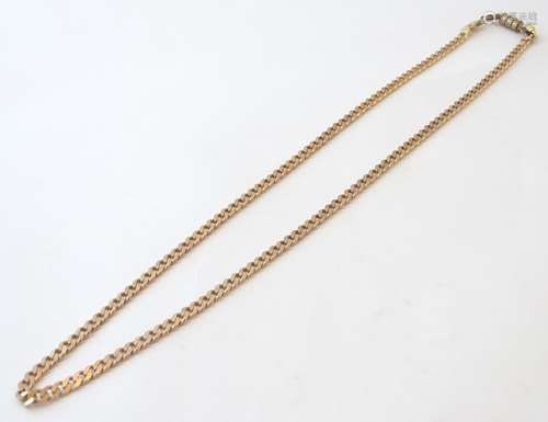 A 9ct gold flat curb link chain. Approx. 20