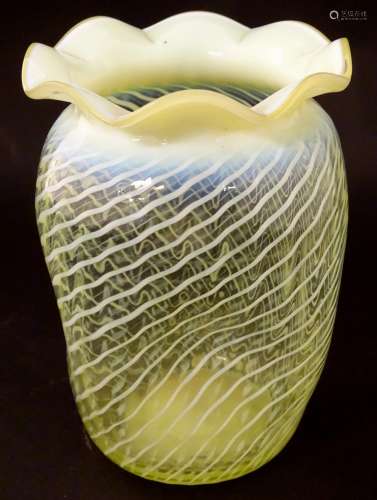 A vaseline glass vase with frilled rim 6