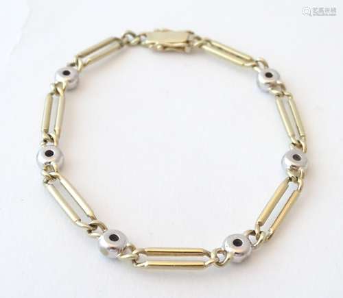 A 14ct gold bracelet having 6 diamonds set in white gold. Approx. 7