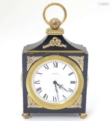 A 20thC Swiss mantle / alarm clock with an 8 day movement,