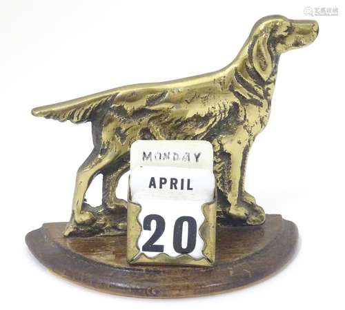 A desk calendar with a brass setter / pointer dog. approx. 4