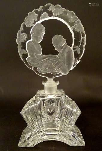 A glass scent bottle flask / the stopper with moulded decoration depicting a young couple.