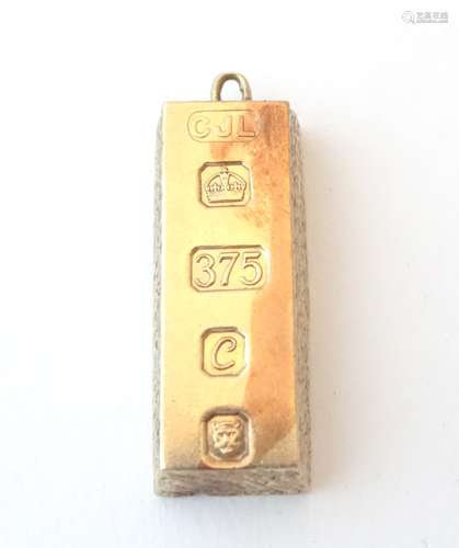 A retro 9ct gold pendant of ingot form, hallmarked Sheffield 1977, with silver Jubilee mark,