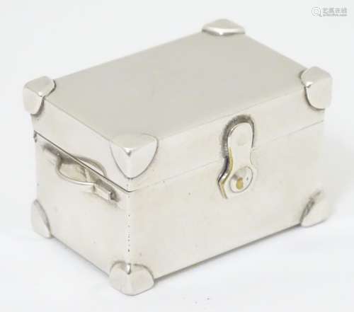 A novelty white metal pill box formed as a trunk 1 3/4