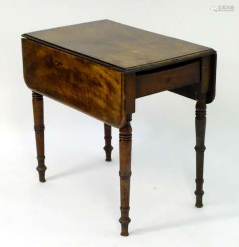 A 19thC mahogany pembroke table with a single end drawer and standing on four turned tapering legs.