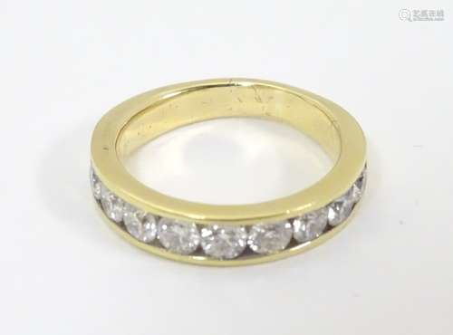 An 18ct gold half eternity ring set with 10 diamonds ( the diamonds approx .20ct) Ring size approx.