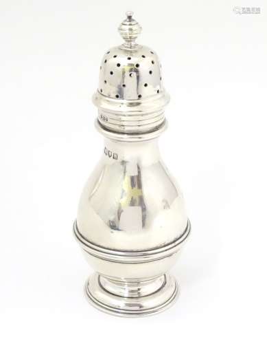 A silver sugar shaker / caster / muffineer hallmarked London 1908 maker Wakely & Wheeler.