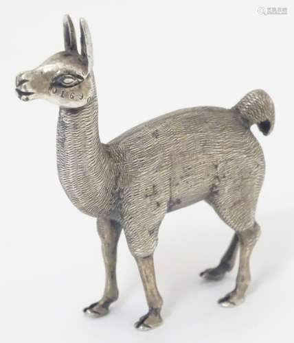 A white metal model of a Lama / Alpaca 2 1/2