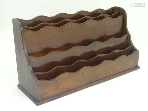 A 19thC mahogany waterfall letter / stationary rack comprising eight sections. Approx.