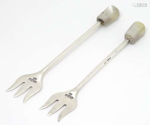 Two silver butter / sweet meat forks with mother of pearl handles, hallmarked Sheffield 1936,