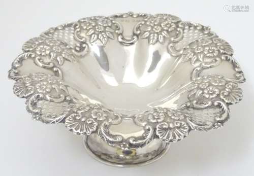 A Victorian silver pedestal bowl with embossed and pierced decoration. Hallmarked Birmingham 1899.