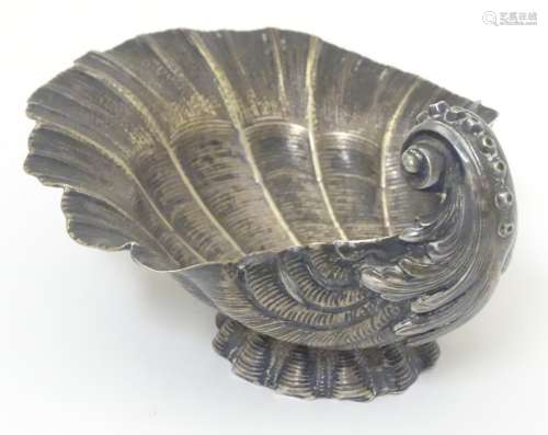 A Continental silver dish formed as a scallop shell.