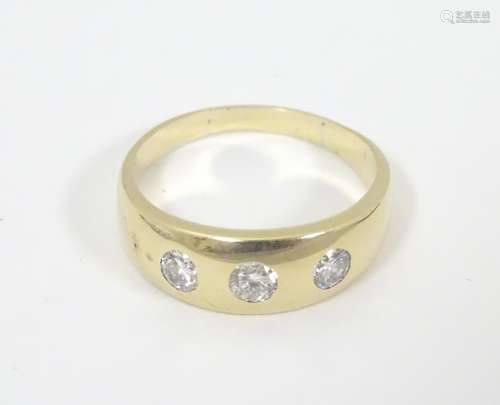 A Continental 18ct gold ring set with three brilliant cut diamonds. Each diamond approx .