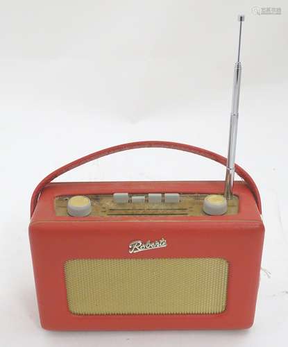 A late 20thC Roberts R250 portable radio, with red vinyl covering,