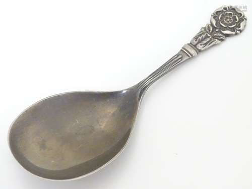 A silver caddy spoon, with Tudor rose to handle, hallmarked Birmingham 1973, maker J. B.