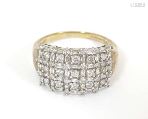 A 9ct gold dress ring set with a profusion of diamonds. Ring size approx.