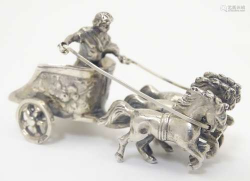 A Continental silver model of a Roman figure in chariot with horses.