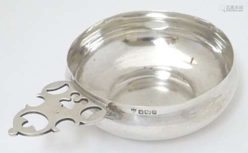 A silver bowl / large quaiche / porringer with handle having openwork decoration.