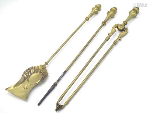 A 20thC set of brass fire tools, comprising poker, shovel and tongs.