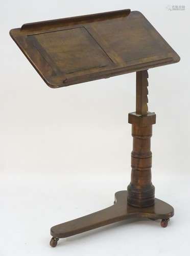 A late 19thC ‘Leveson & Sons’ mahogany reading stand / lectern with an adjustable top and writing