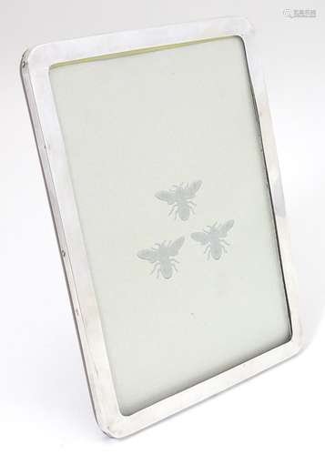 An easel back photograph frame with silver surround hallmarked Birmingham 1915 to fit photograph 8