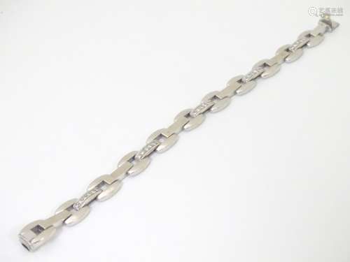 An Italian 18ct white gold bracelet of link form, set with 5 bands of 6 diamonds,