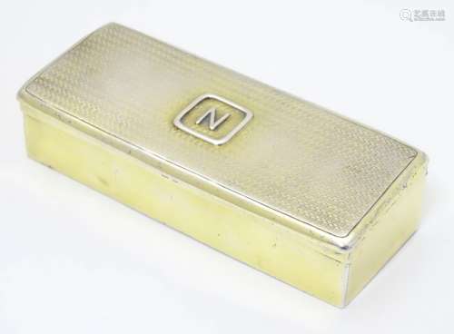 A silver gilt box with engine turned decoration to lid.