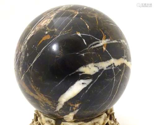 A polished specimen hardstone sphere. Approx.