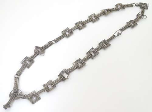 A Continental white metal necklace formed with filigree work links.