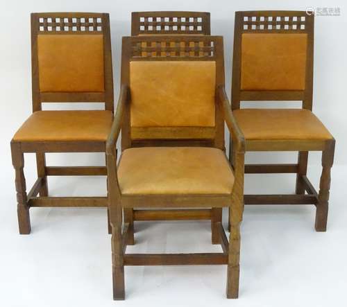 A set of four oak Arts and Crafts style dining chairs in tan leather made by Derek ‘Lizardman’