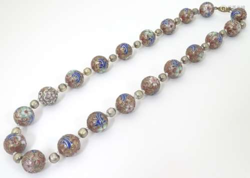 A vintage bead necklace set with enamel decorated large beads. The beads approx 1/2
