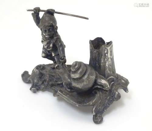 A Novelty silver taper stick stand the base formed as a gnome and a snail. Maker K & Co.