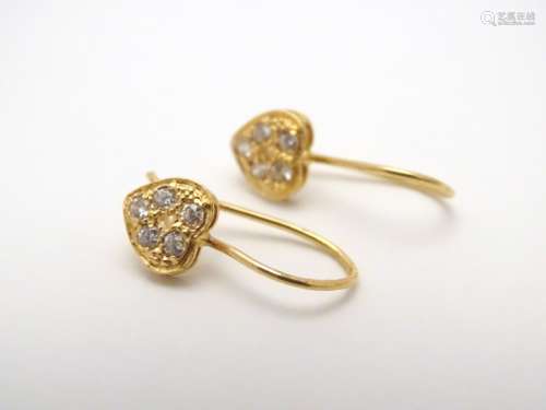 A pair of 9ct gold earrings set with 5 cubic zirconia in a heart shaped setting. Approx. 1/2